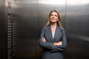Cape Town/South Africa. Business woman in elevator